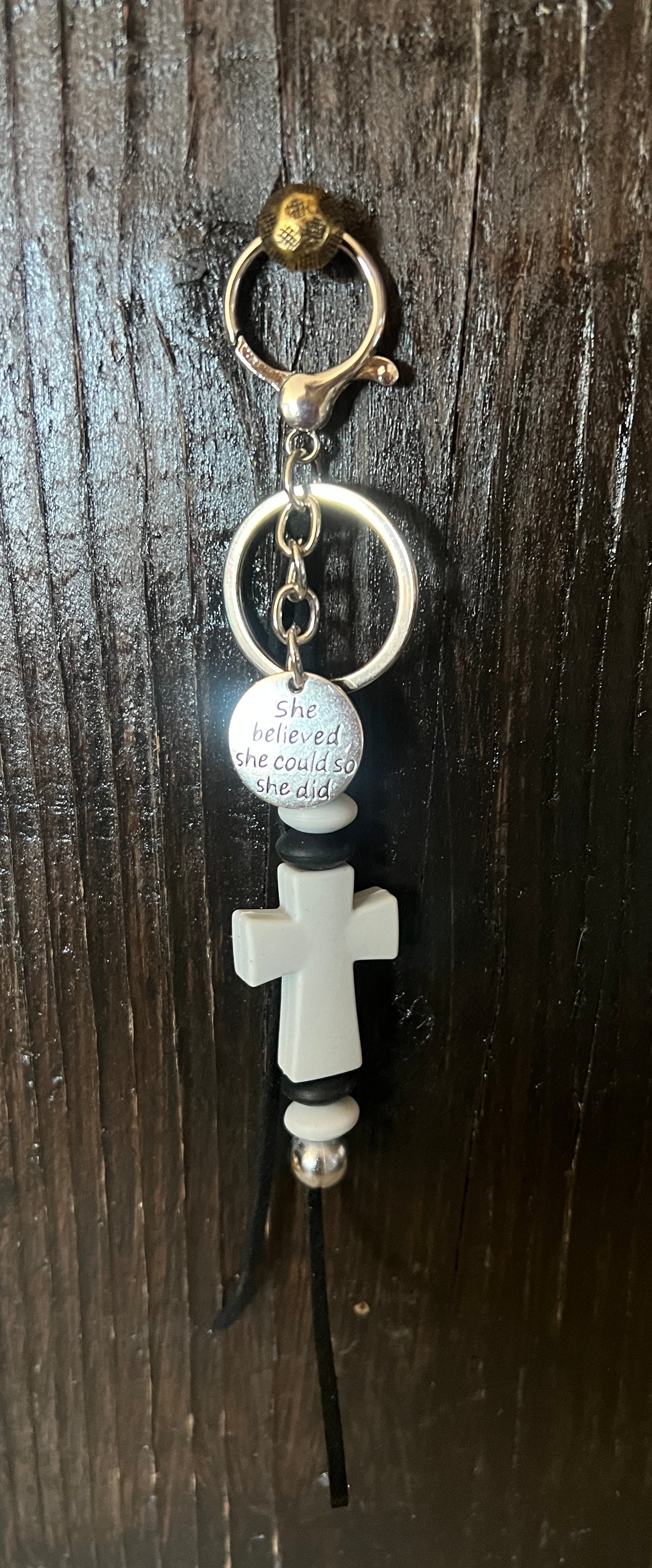 Cross saddle charm (light gray cross, black and gray beads)