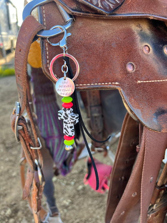 Cow print cross saddle charm (neon green and orange beads)