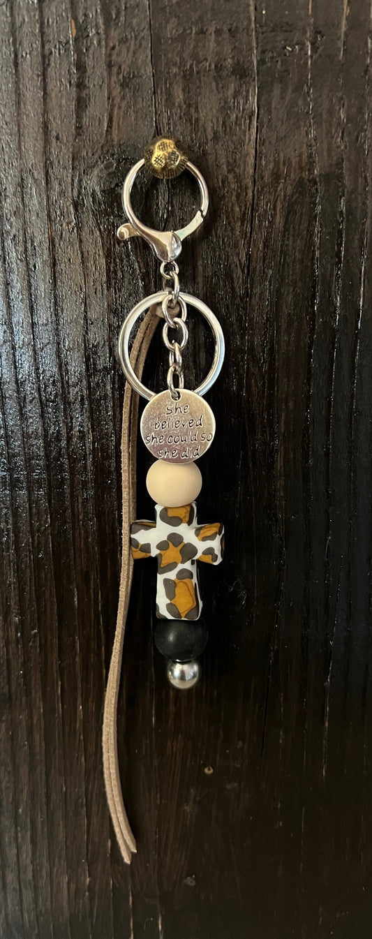 Cheetah print cross saddle charm (tan and black beads)