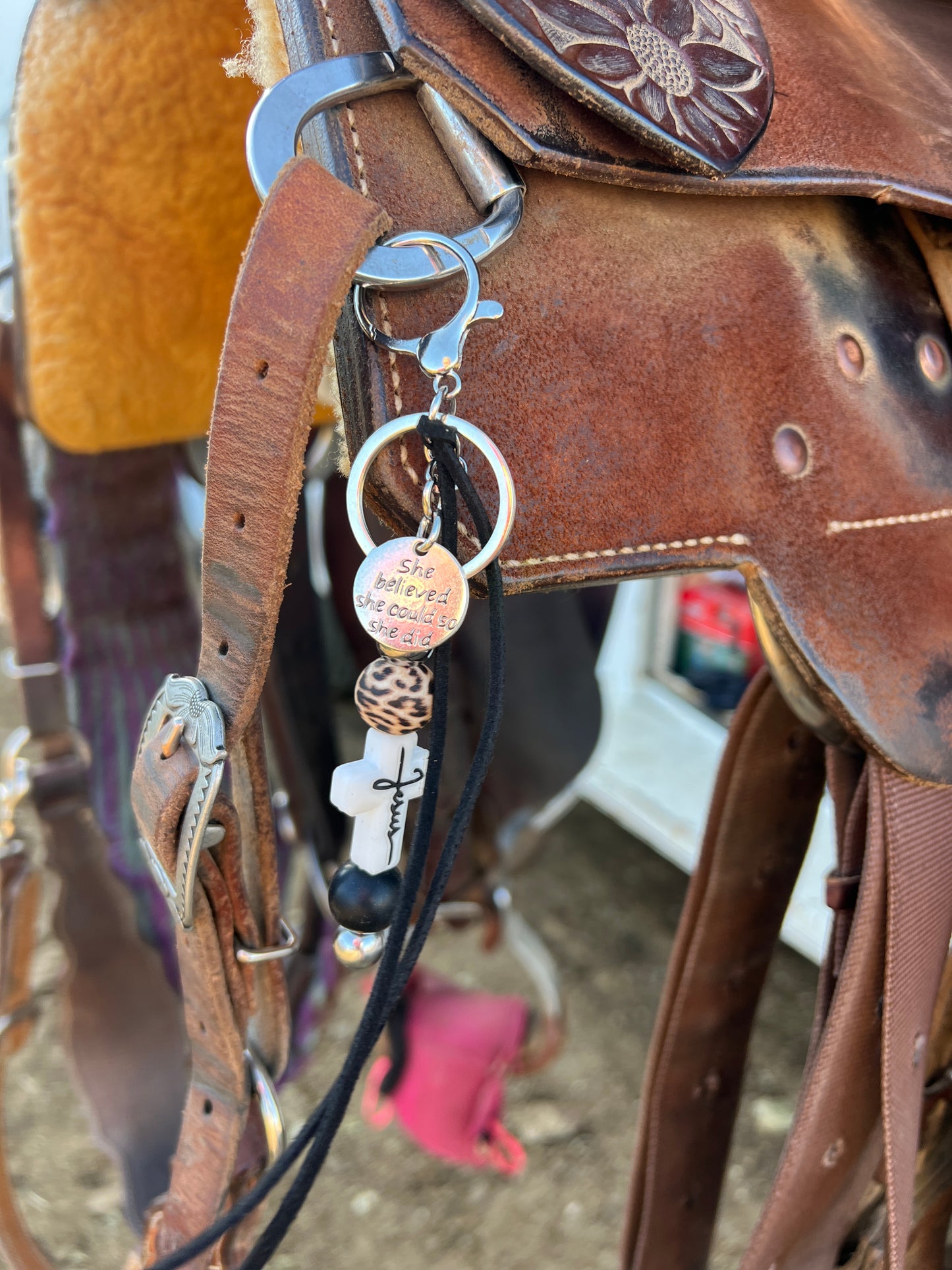 “Jesus” saddle charm (white cross, black and cheetah beads)