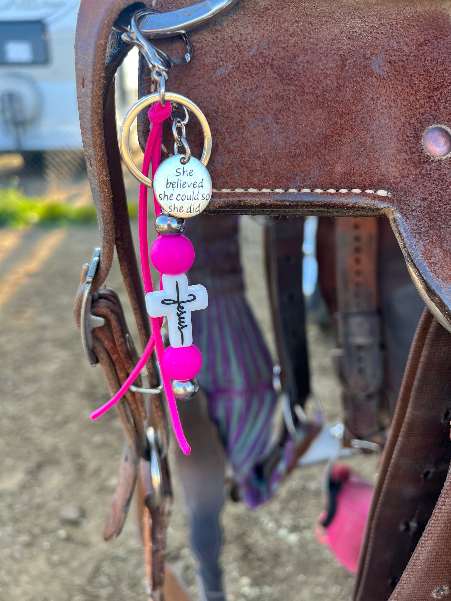 “Jesus” saddle charm (white cross, pink beads)