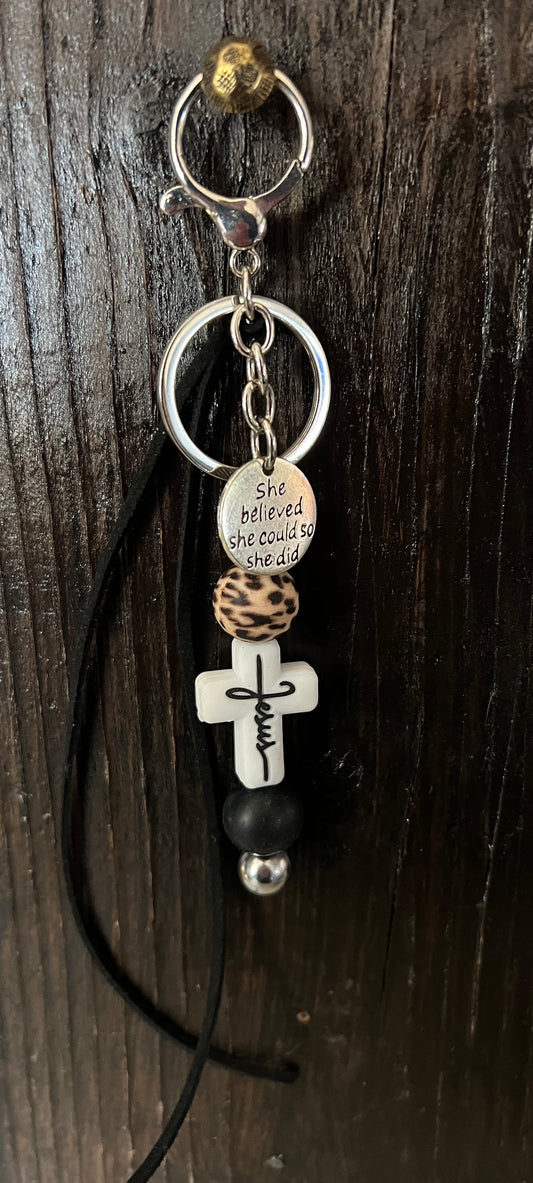 “Jesus” saddle charm (white cross, black and cheetah beads)